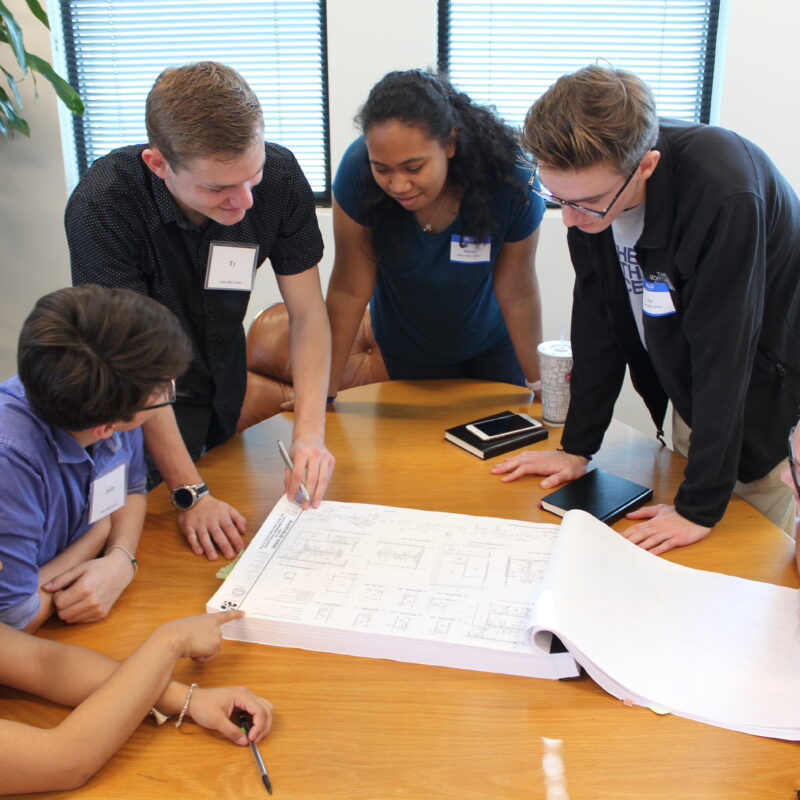 EcoRise green building interns study site plans at BLGY Architecture