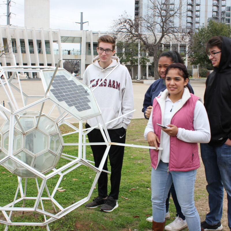 Sophia analyzing a sculpture at the Mexican American Cultural Center in Austin Texas with fellow Green Building Interns