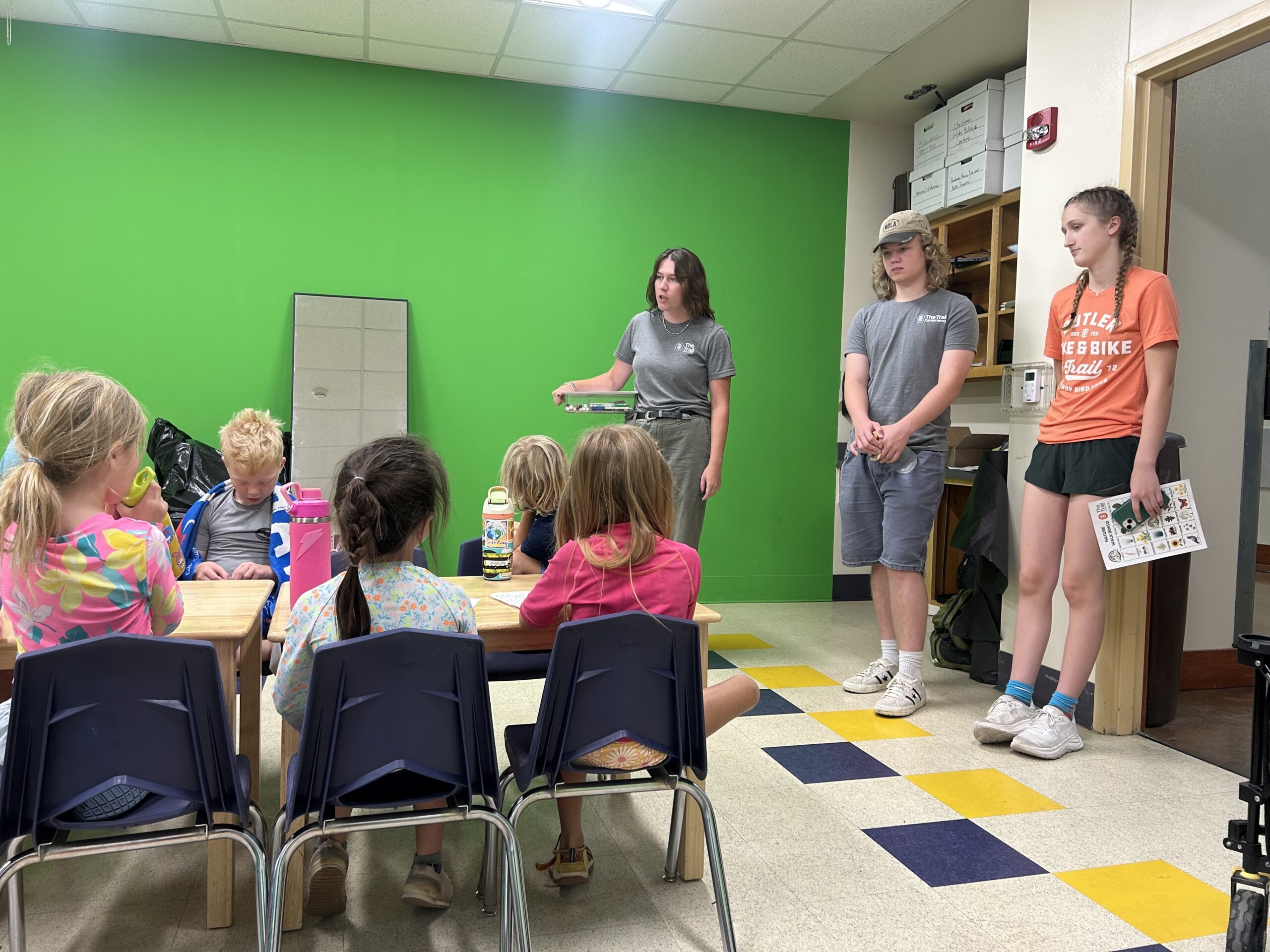 Clara and Luke facilitating an activity for a summer camp hosted by The Trail Conservancy.